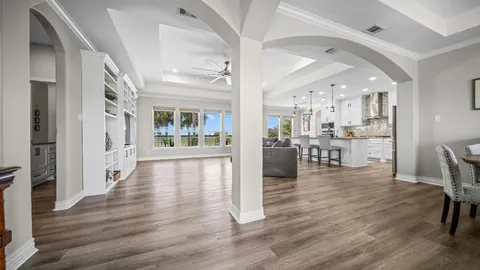a view of a dining room kitchen with furniture and wooden floor