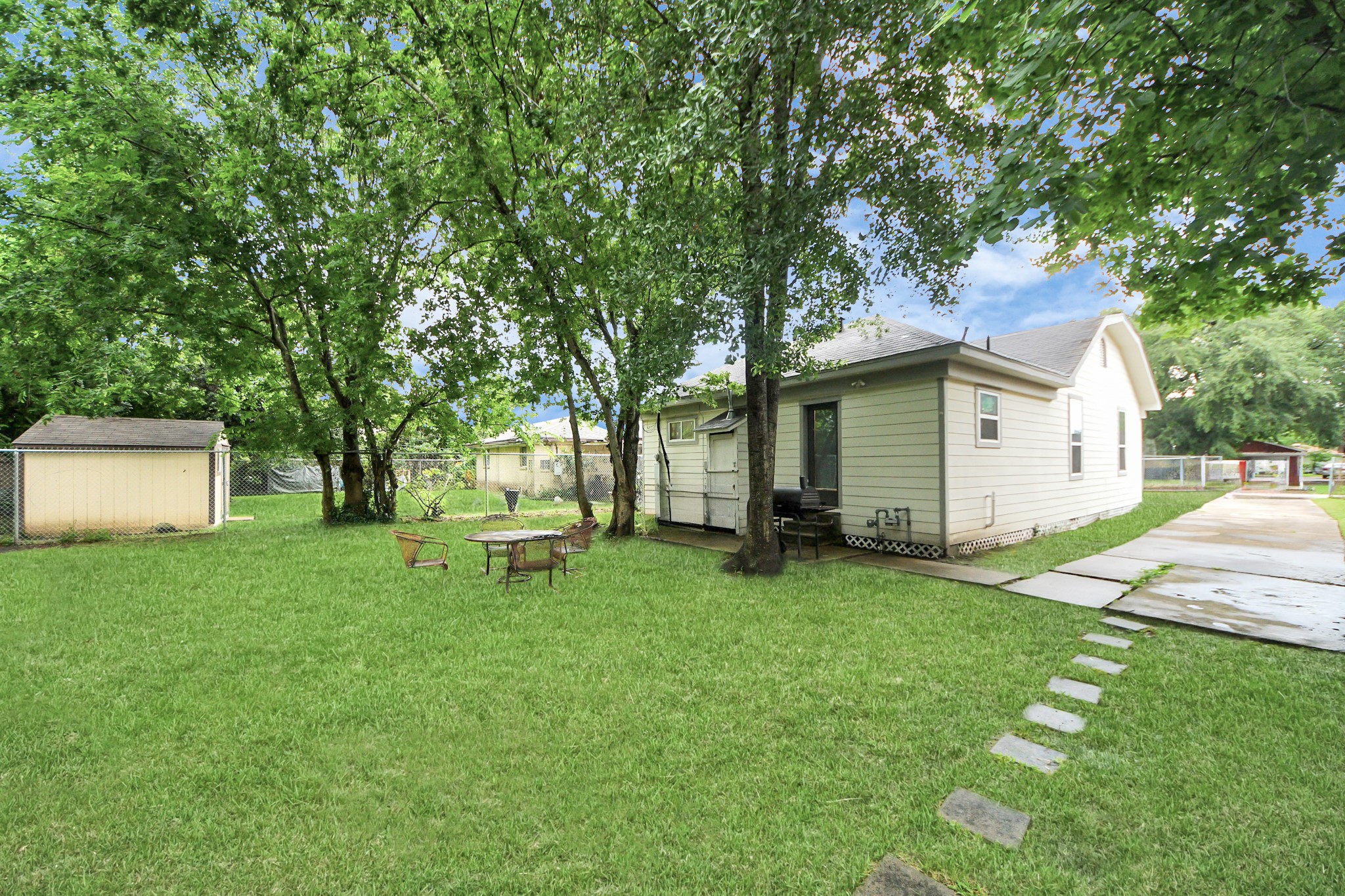 6917 Rook Boulevard Houston, TX 77087 - Photo 14 of 32 a white house that has a tree in front of it