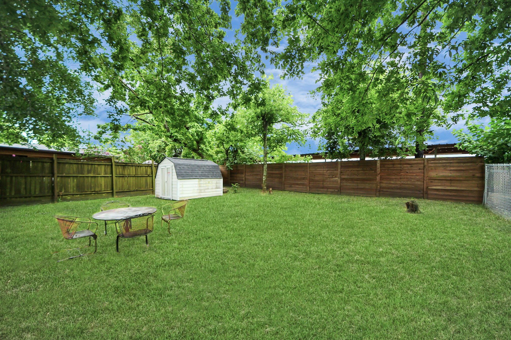 6917 Rook Boulevard Houston, TX 77087 - Photo 15 of 32 a view of a wooden deck and a yard