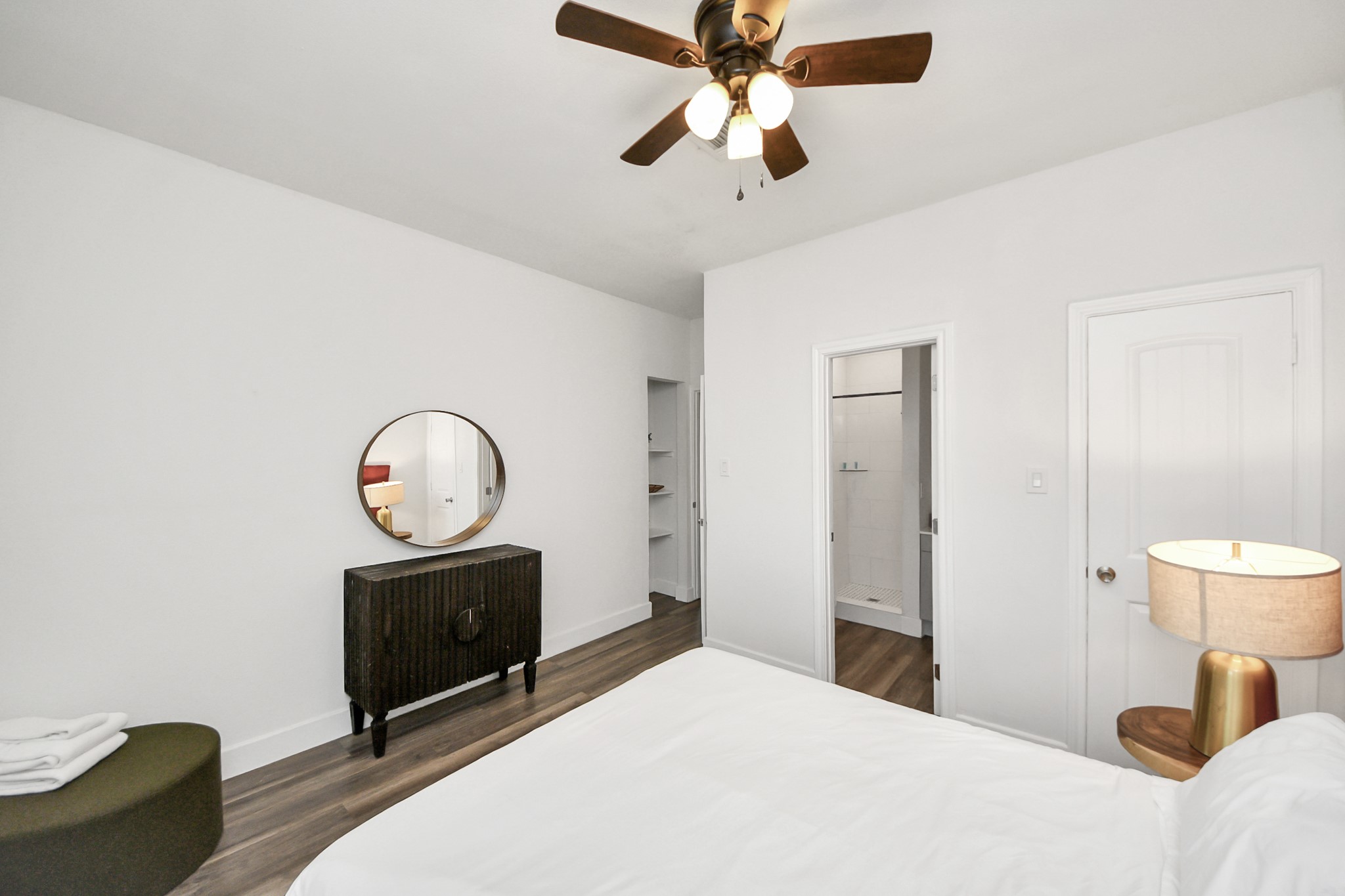 6917 Rook Boulevard Houston, TX 77087 - Photo 21 of 32 a bedroom with a bed and a chandelier