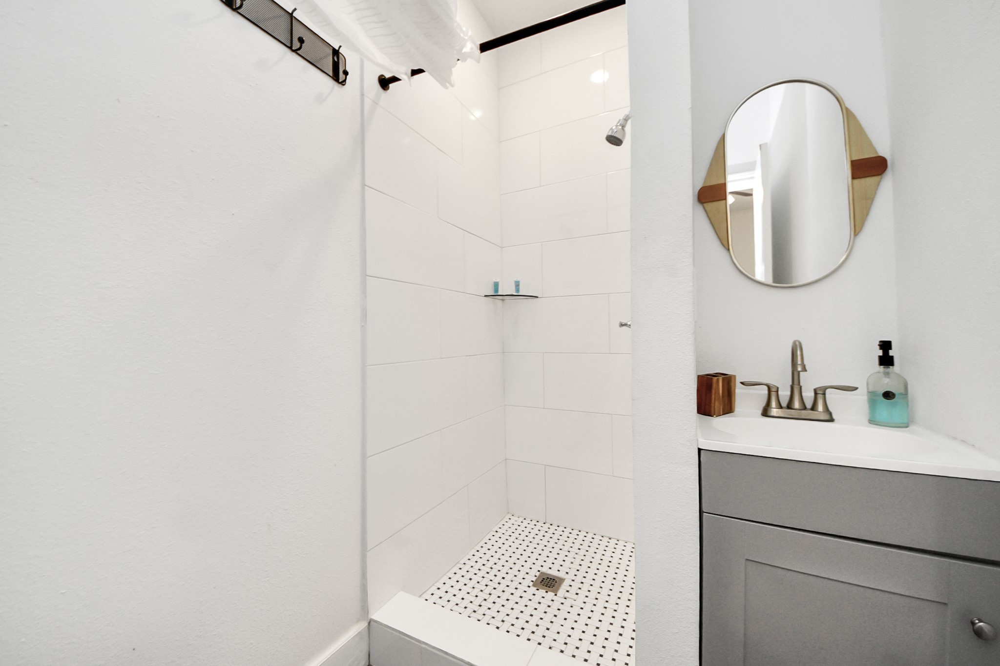 6917 Rook Boulevard Houston, TX 77087 - Photo 25 of 32 a bathroom with a sink a vanity and a mirror