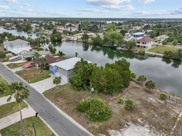an aerial view of a house with a lake view