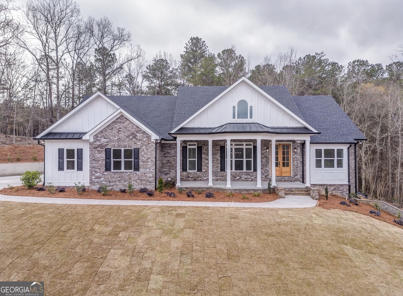 a front view of a house with a yard