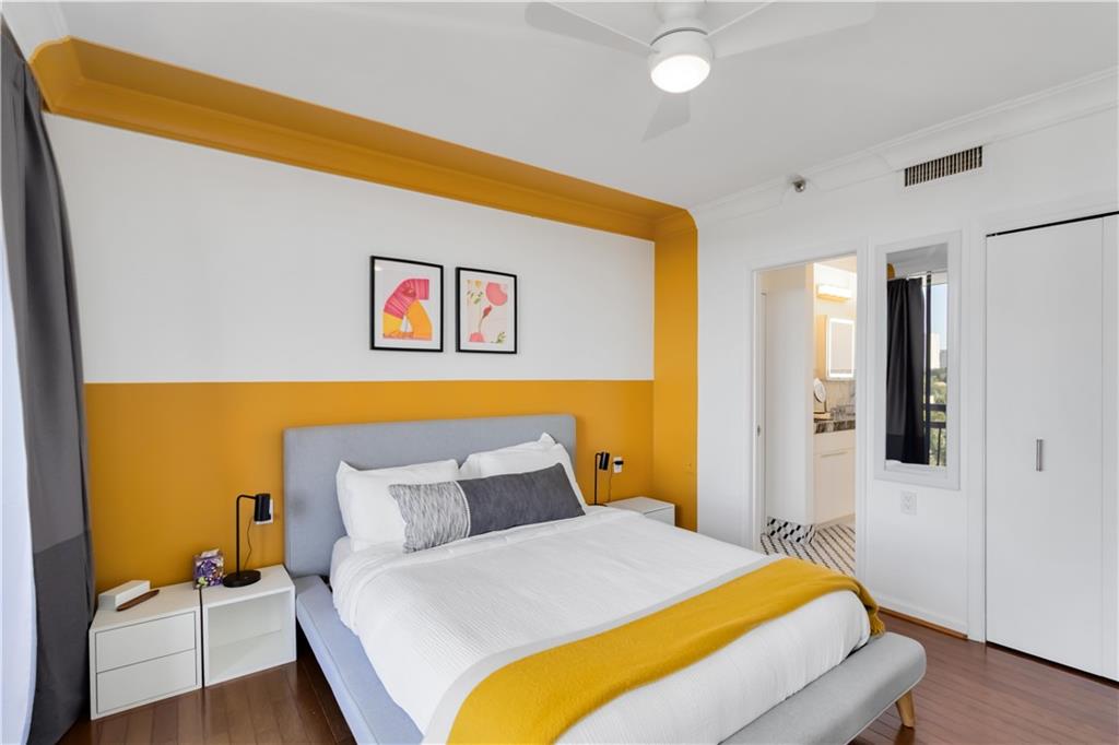 1130 Piedmont Avenue Northeast, Unit 1109 Atlanta, GA 30309 - Photo 11 of 40 a bedroom with a bed and a couch