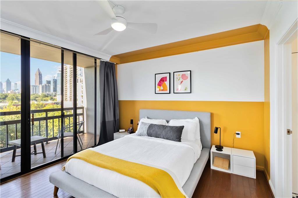 1130 Piedmont Avenue Northeast, Unit 1109 Atlanta, GA 30309 - Photo 12 of 40 a bedroom with a bed and glass door