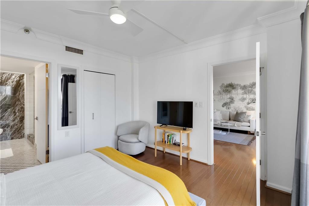 1130 Piedmont Avenue Northeast, Unit 1109 Atlanta, GA 30309 - Photo 13 of 40 a bedroom with a bed and a flat screen tv