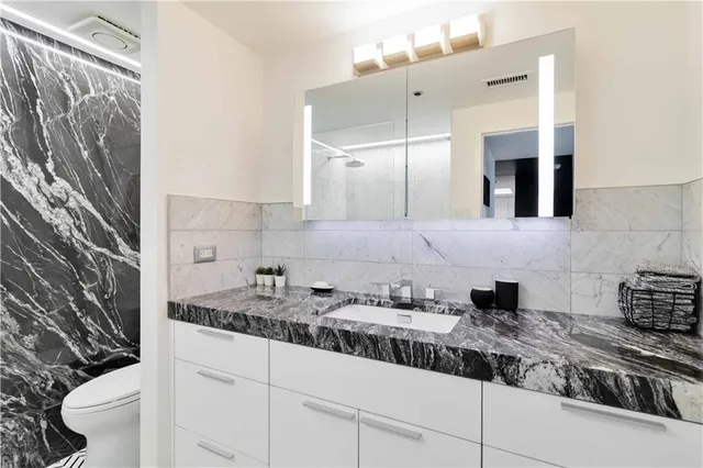 a kitchen with a sink and cabinets