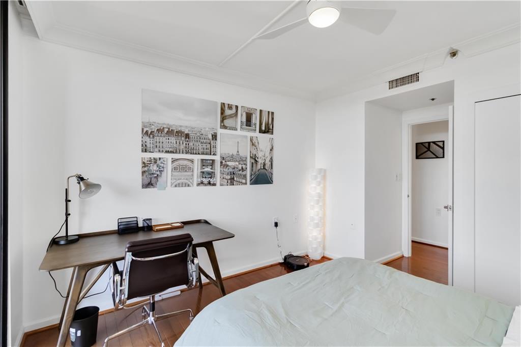 1130 Piedmont Avenue Northeast, Unit 1109 Atlanta, GA 30309 - Photo 22 of 40 a bedroom with a bed and a desk