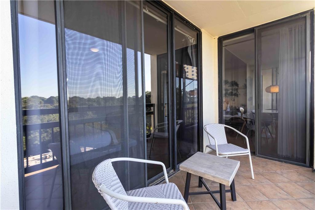 1130 Piedmont Avenue Northeast, Unit 1109 Atlanta, GA 30309 - Photo 25 of 40 a bathroom with a toilet a sink and mirror
