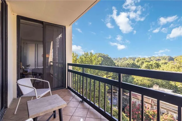 a view of a chair and table in the balcony