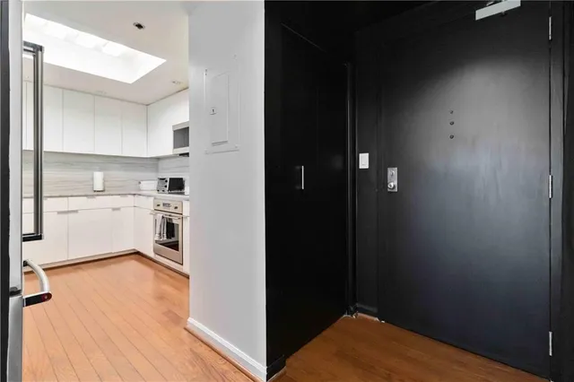 a view of kitchen with wooden floor
