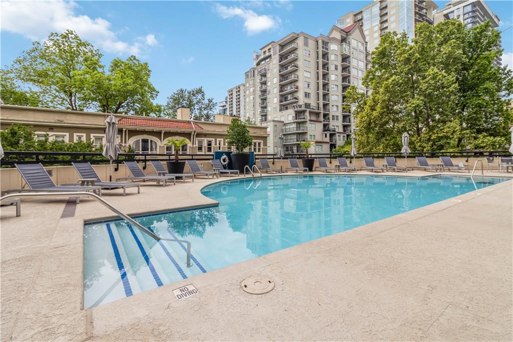 1130 Piedmont Avenue Northeast, Unit 1109 Atlanta, GA 30309 - Photo 34 of 40 swimming pool view with a outdoor seating space