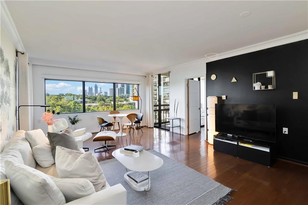 1130 Piedmont Avenue Northeast, Unit 1109 Atlanta, GA 30309 - Photo 4 of 40 a living room with furniture and a flat screen tv