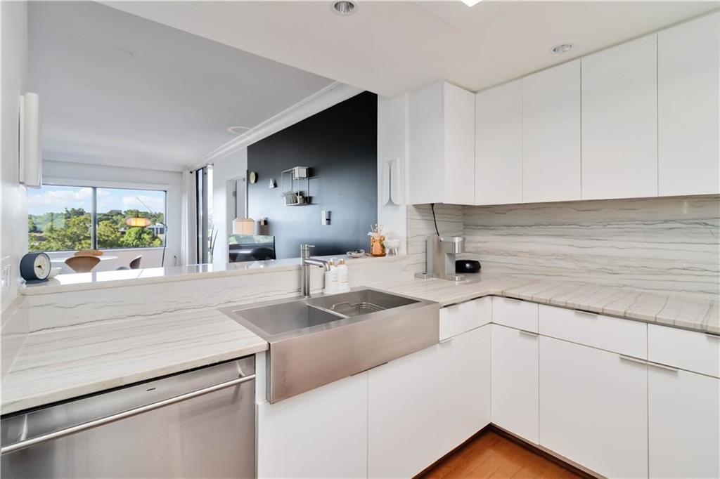1130 Piedmont Avenue Northeast, Unit 1109 Atlanta, GA 30309 - Photo 8 of 40 a kitchen with a sink and cabinets