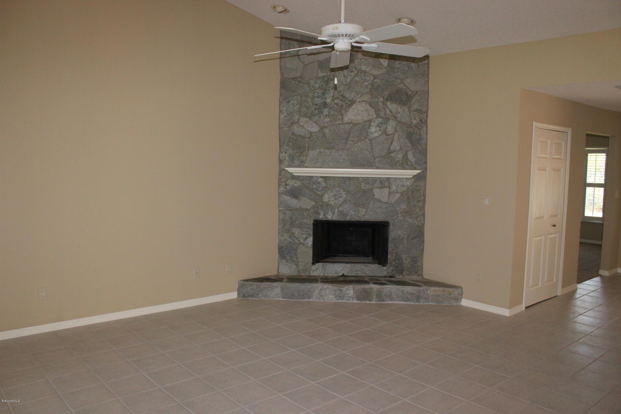 3745 Corey Road Grant Valkaria, FL 32950 - Photo 6 of 14 family room with fireplace
