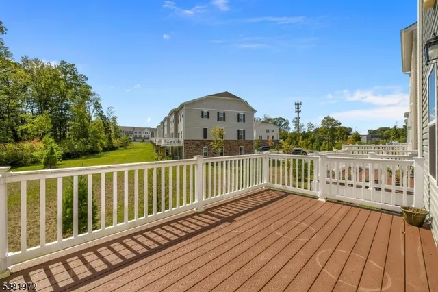 a view of a balcony with wooden floor