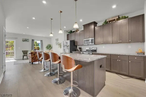 a kitchen with lots of counter space and glass door