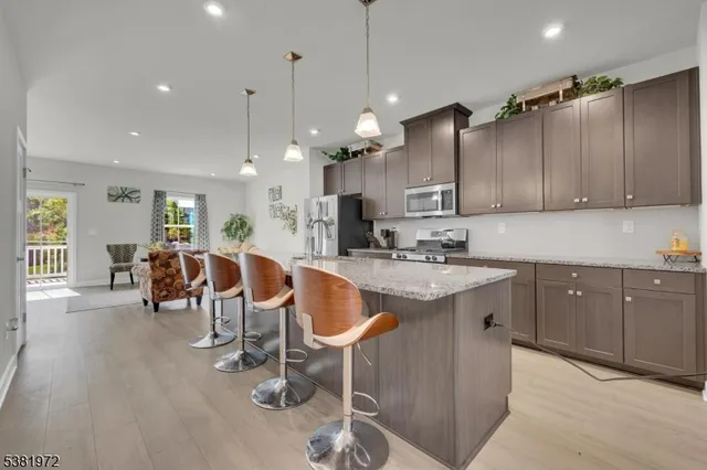 a kitchen with lots of counter space and glass door