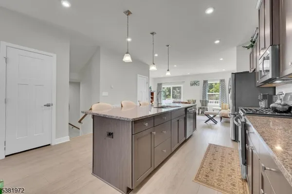 a kitchen with counter top space and sink
