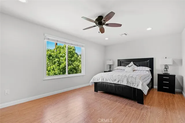 a bedroom with a bed and a dresser