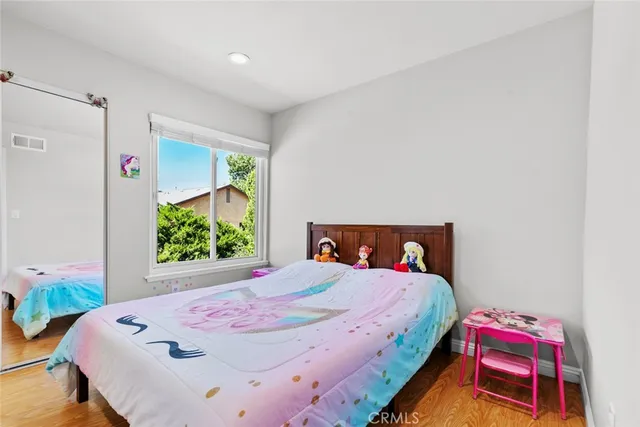 a bedroom with a bed and furniture