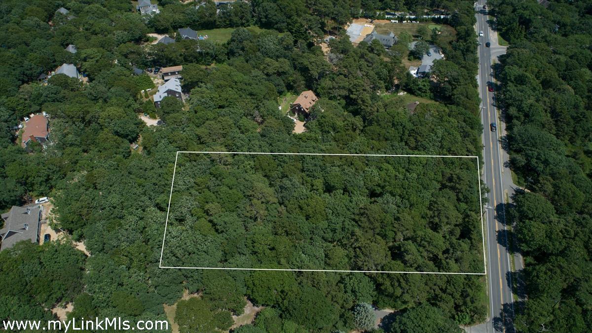501 West Tisbury Road Edgartown, MA 02539 - Photo 4 of 4 an aerial view of a residential houses with outdoor space and trees all around
