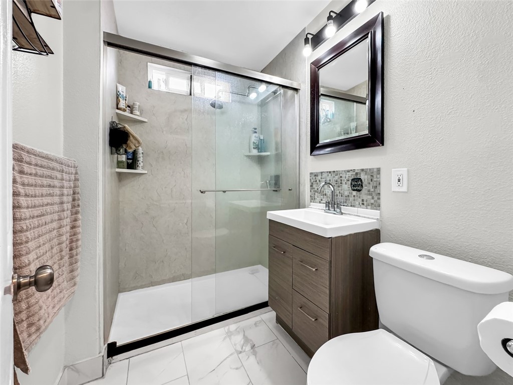 412 West Pear Street Compton, CA 90222 - Photo 12 of 19 a bathroom with a sink toilet and shower