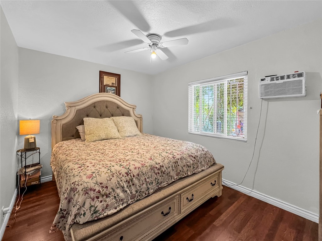 412 West Pear Street Compton, CA 90222 - Photo 13 of 19 a bedroom with a bed and a window