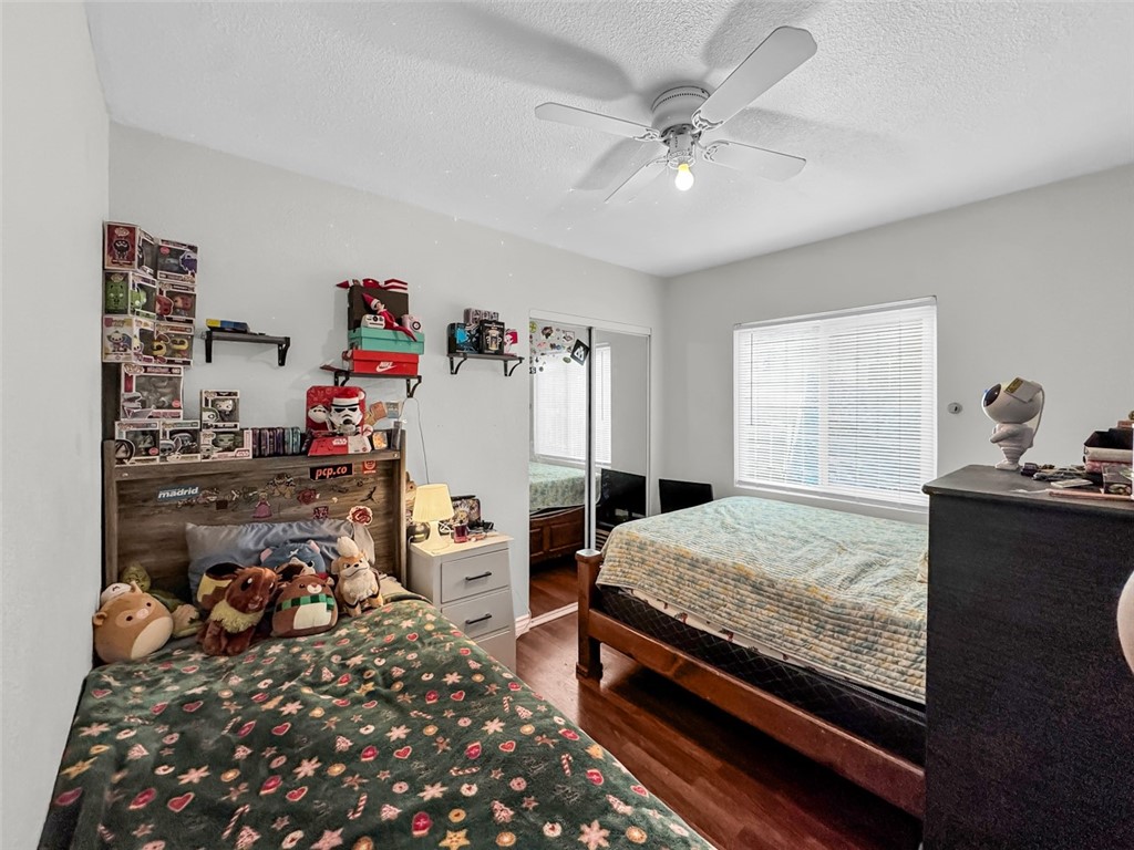 412 West Pear Street Compton, CA 90222 - Photo 14 of 19 a bedroom with bed and a window