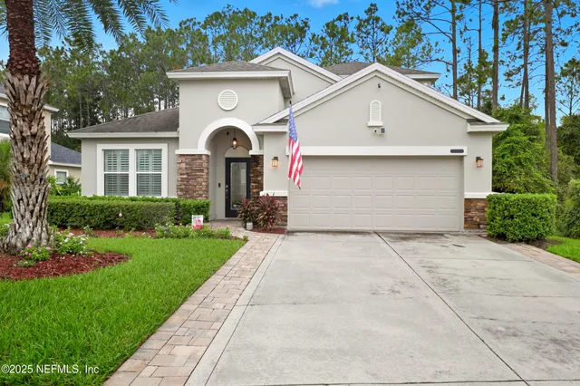 a front view of a house with yard
