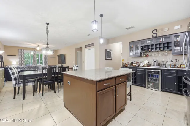 a kitchen with a stove kitchen island table and chairs