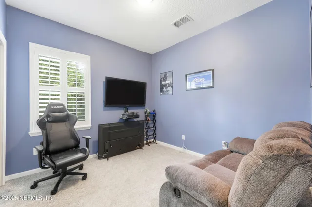 a bedroom with a workspace