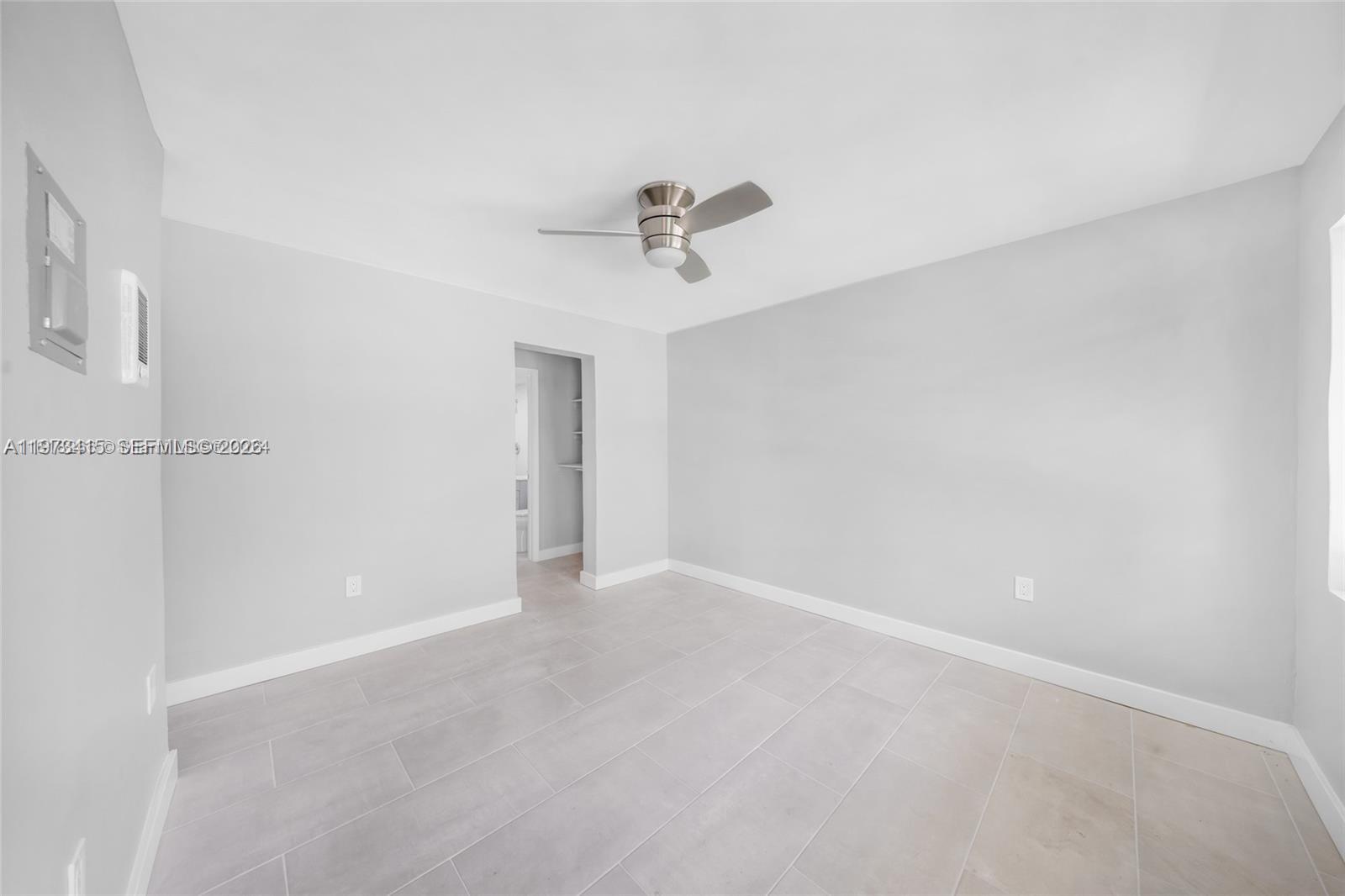 1150 Northwest 1st Place, Unit 2 Miami, FL 33136 - Photo 5 of 19 a view of an empty room with a window