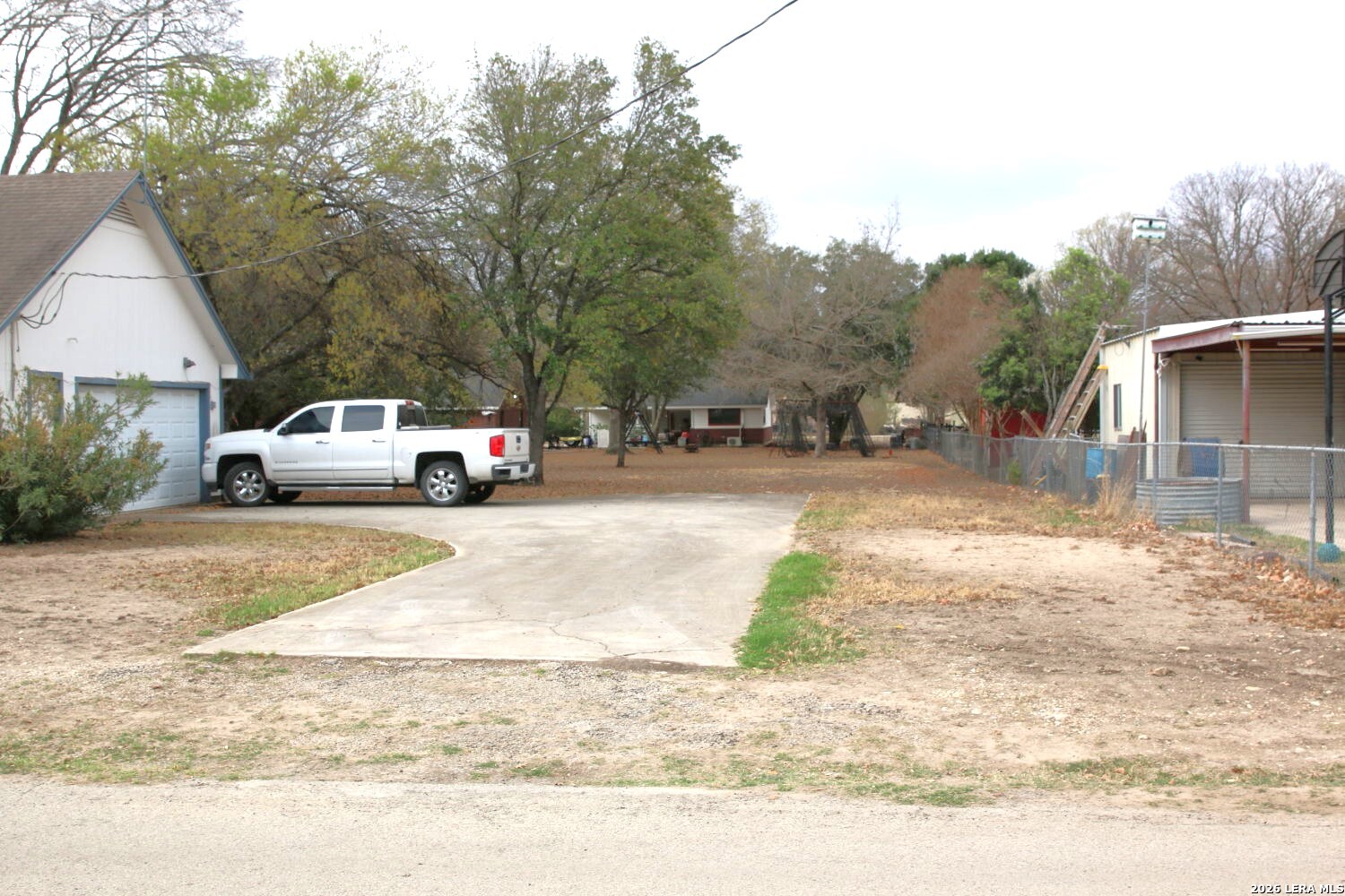 802 Athens Street Castroville, TX 78009 - Photo 11 of 44 a view of street with parked cars