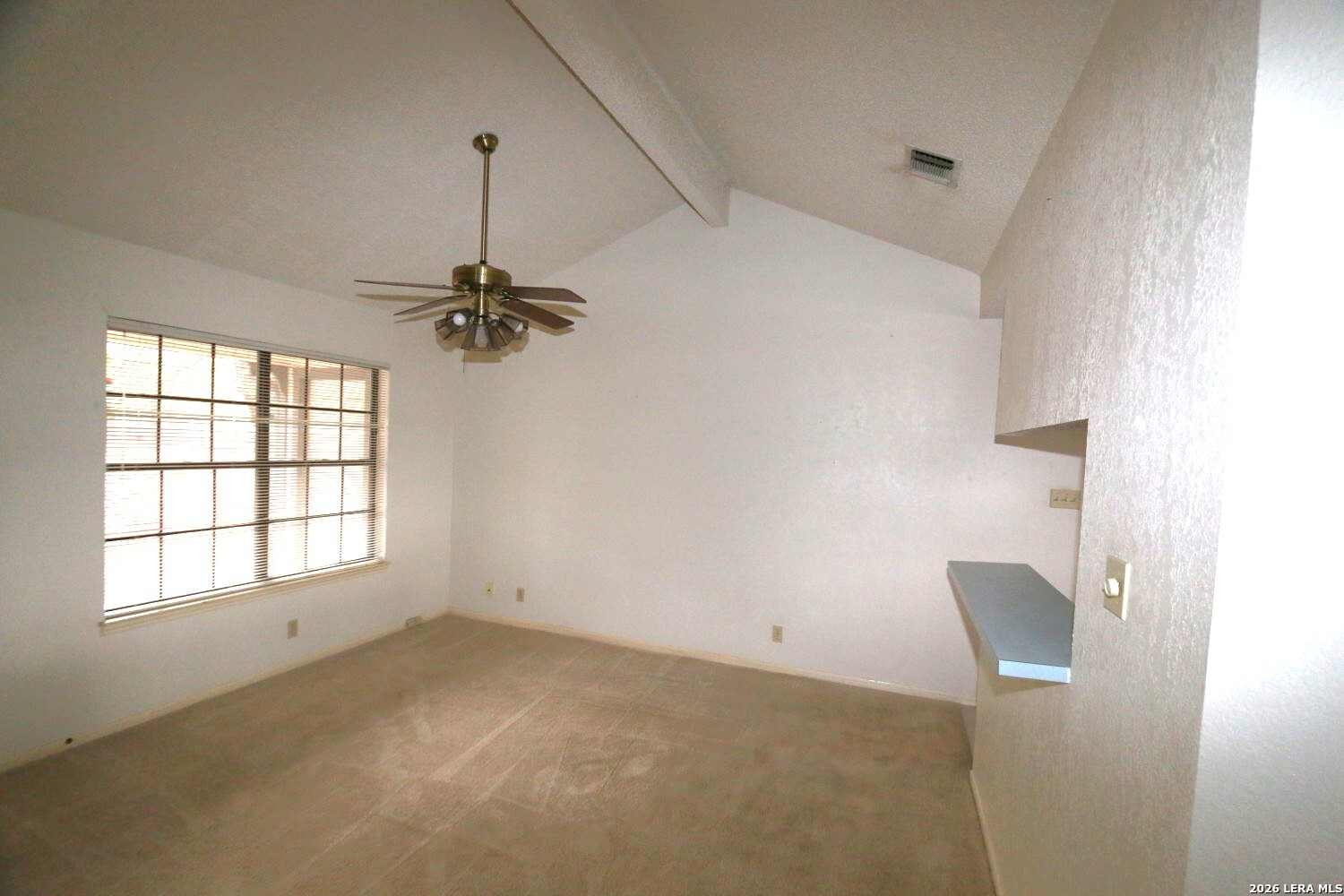 802 Athens Street Castroville, TX 78009 - Photo 13 of 44 an empty room with windows and cabinet