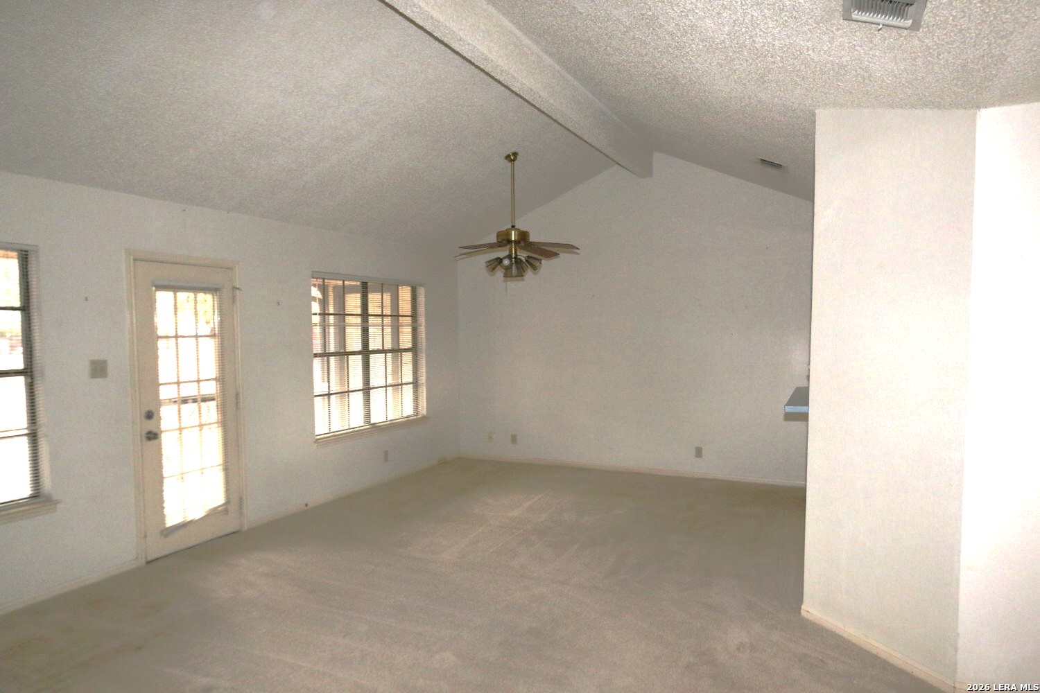 802 Athens Street Castroville, TX 78009 - Photo 17 of 44 an empty room with windows