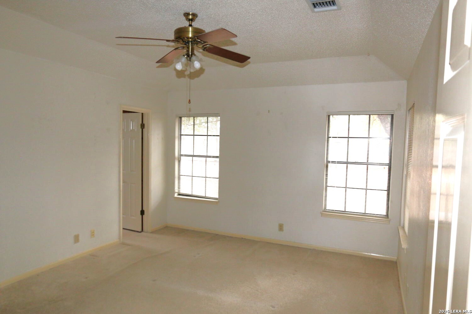 802 Athens Street Castroville, TX 78009 - Photo 18 of 44 a view of an empty room with a window