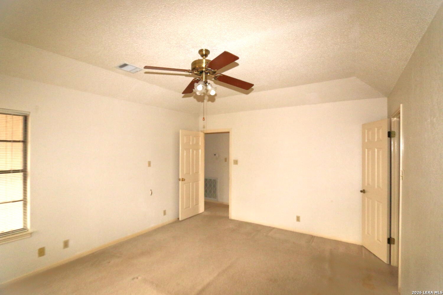 802 Athens Street Castroville, TX 78009 - Photo 20 of 44 a view of a chandelier fan in a empty room
