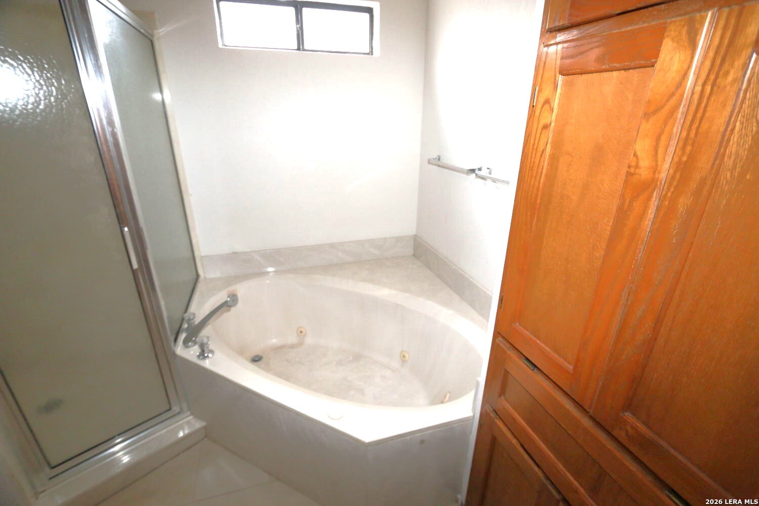 802 Athens Street Castroville, TX 78009 - Photo 22 of 44 a bathroom with a bathtub