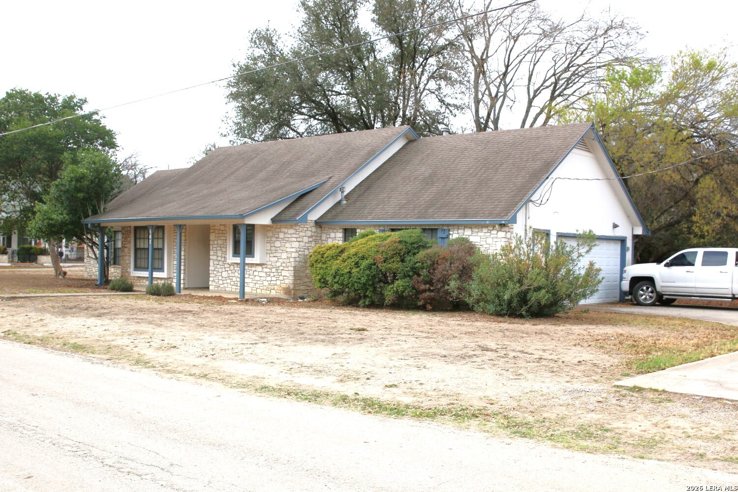 802 Athens Street Castroville, TX 78009 - Photo 3 of 44 a view of a house with a patio