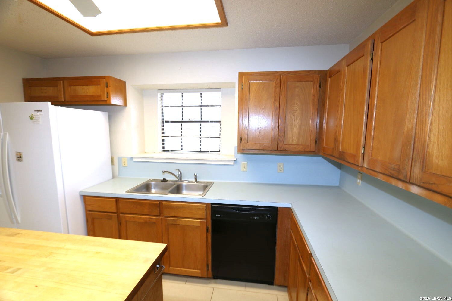 802 Athens Street Castroville, TX 78009 - Photo 31 of 44 a kitchen with a sink a stove and cabinets
