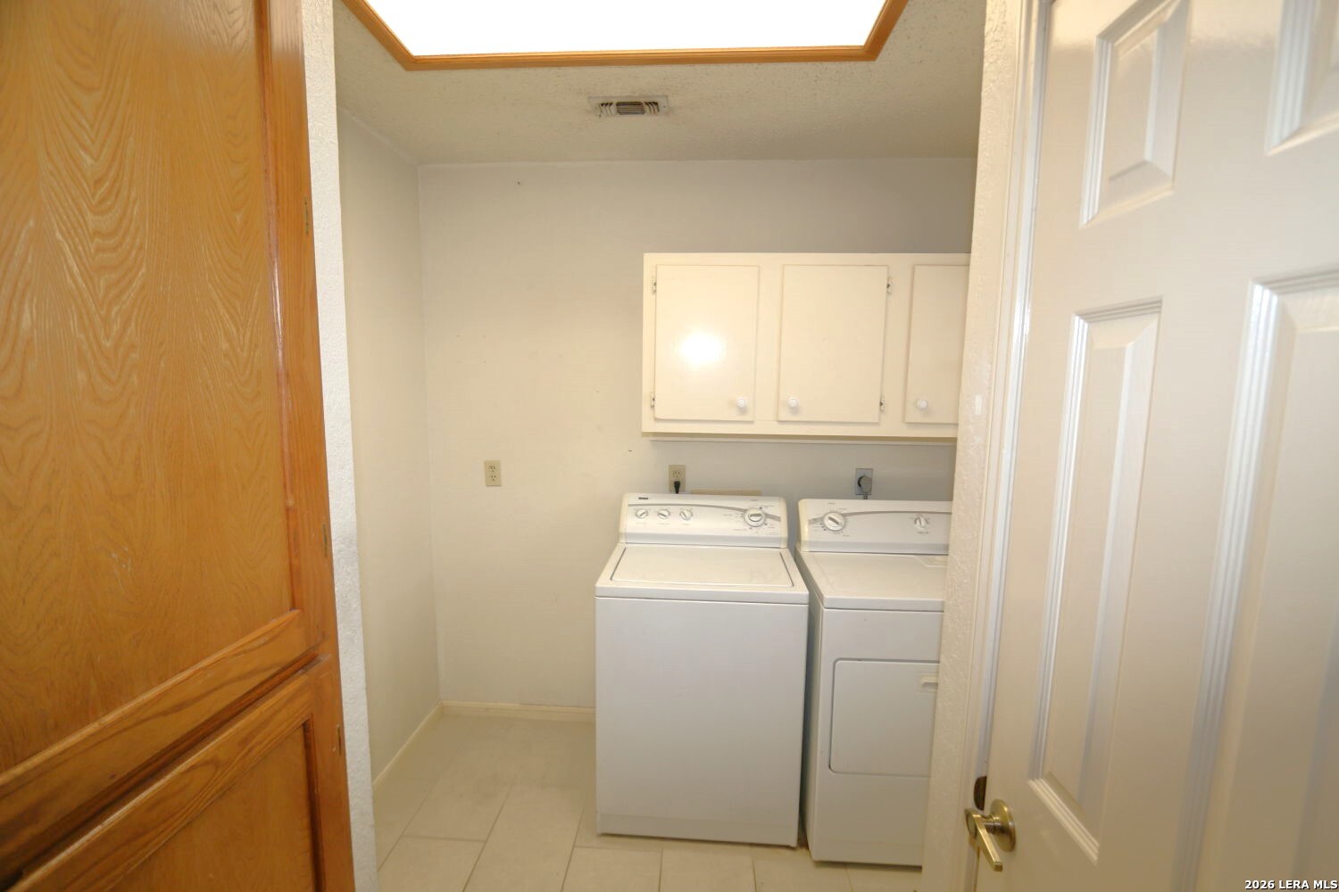 802 Athens Street Castroville, TX 78009 - Photo 33 of 44 a utility room with dryer and washer