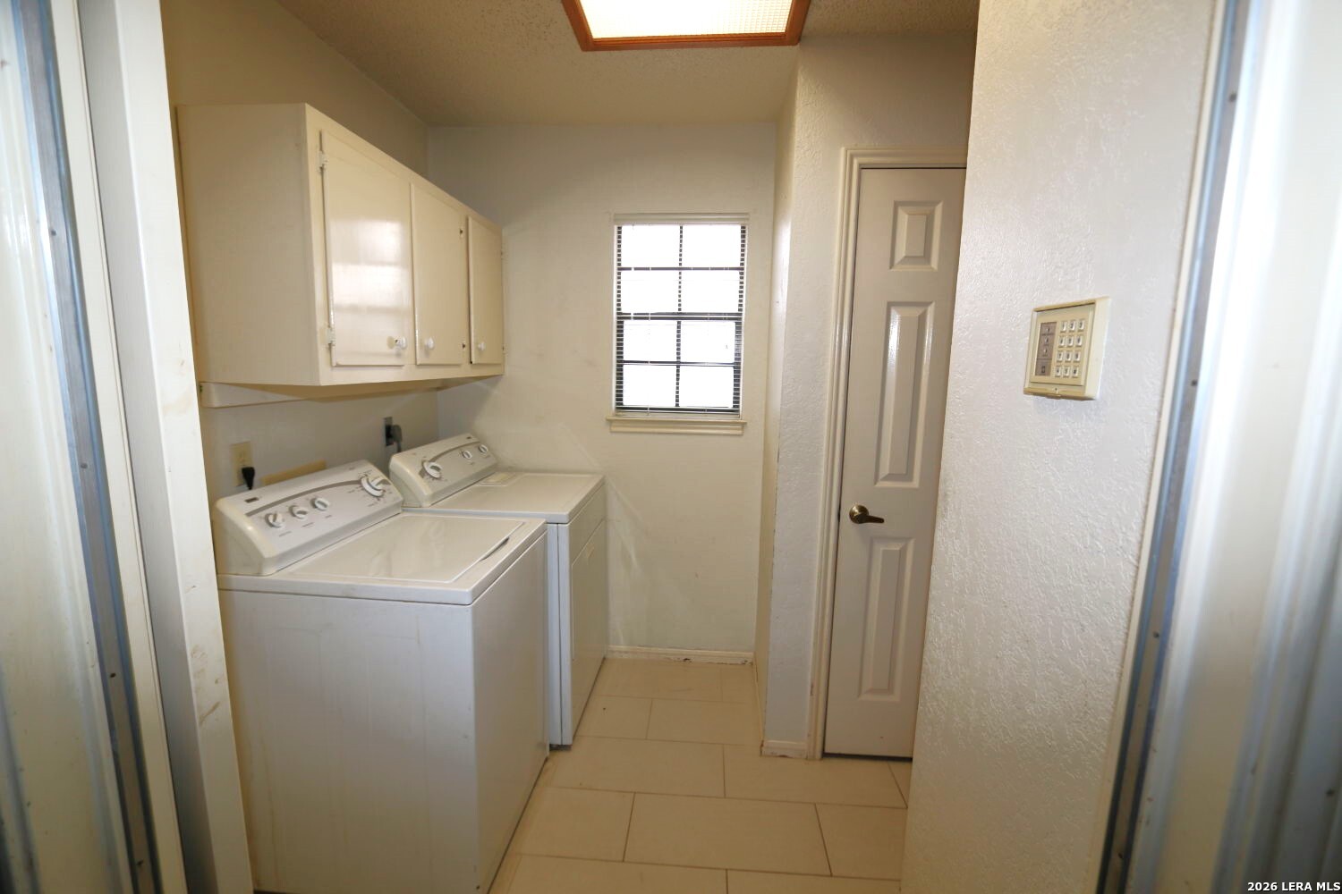 802 Athens Street Castroville, TX 78009 - Photo 34 of 44 a utility room with closet dryer and washer
