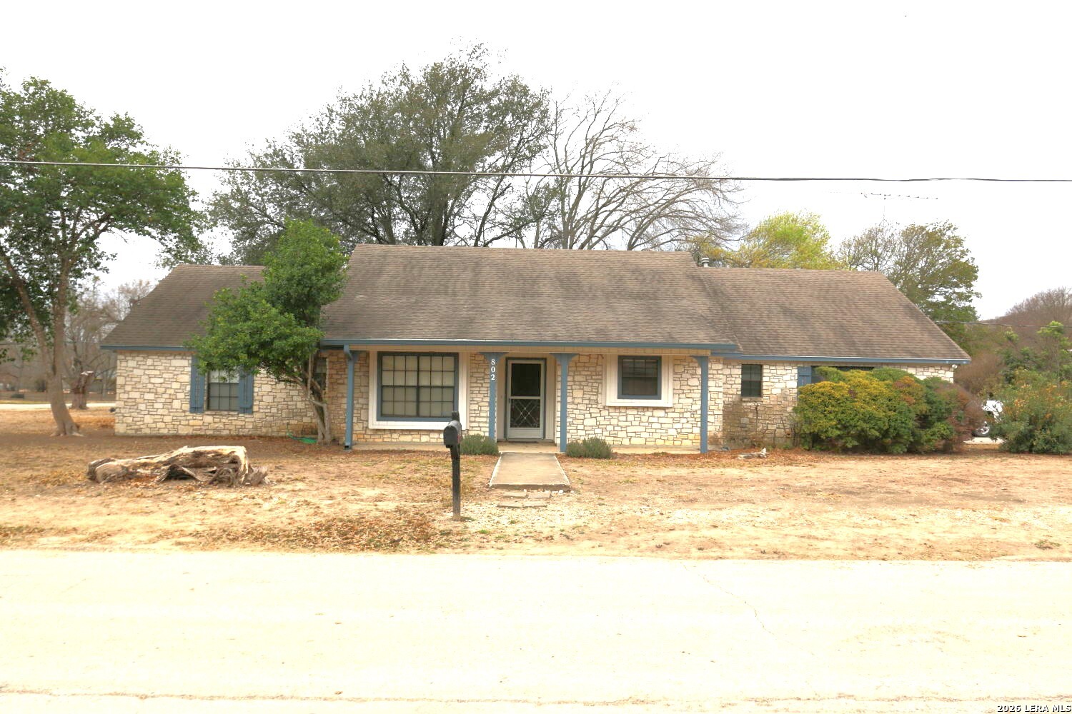 802 Athens Street Castroville, TX 78009 - Photo 44 of 44 a front view of a house with a yard