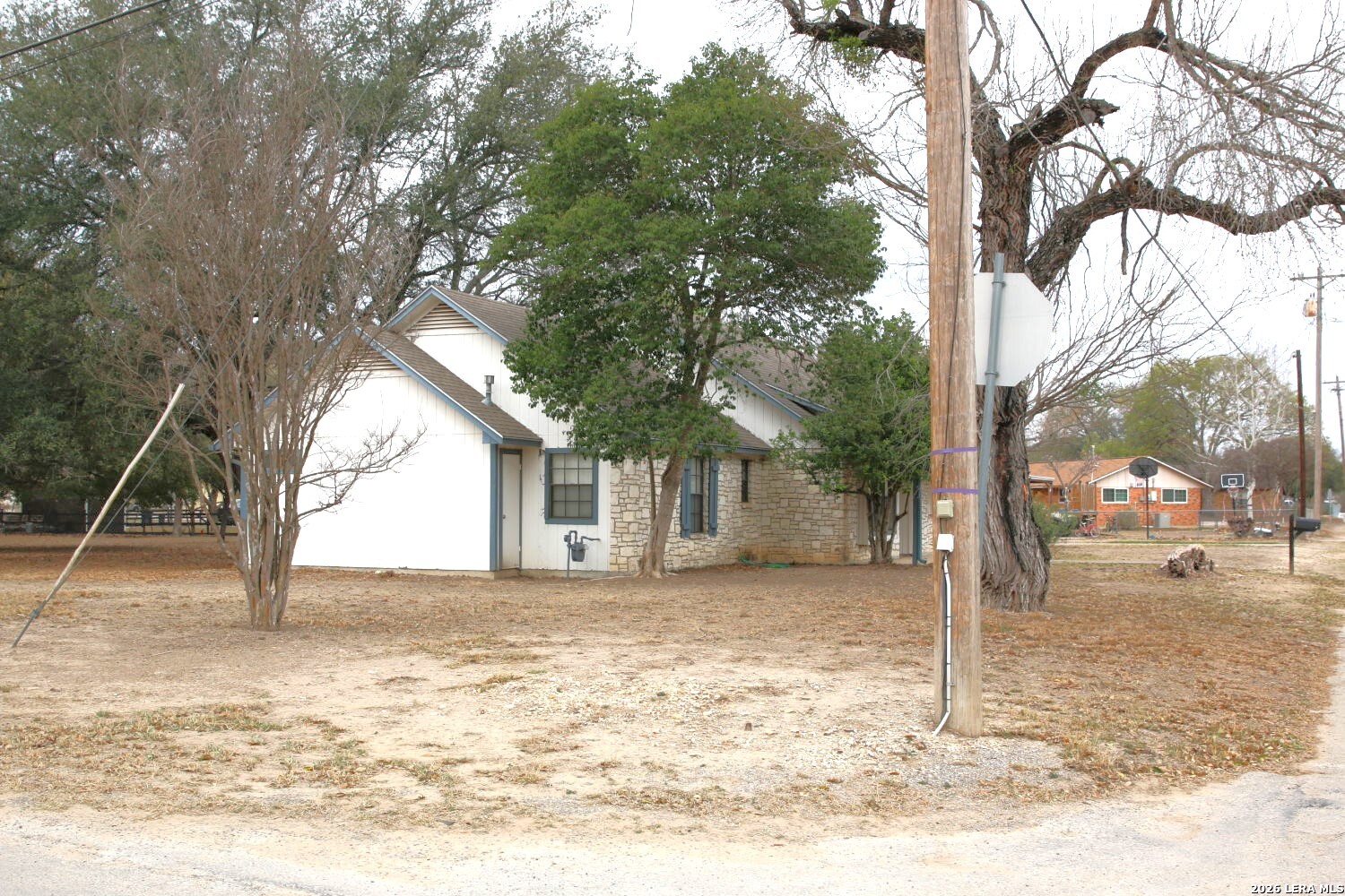 802 Athens Street Castroville, TX 78009 - Photo 9 of 44 a backyard of a house with a tree