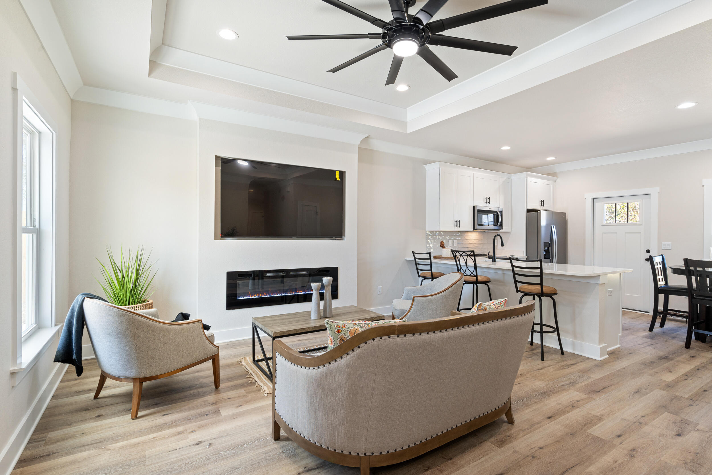 873 Brett Street South Crestview, FL 32539 - Photo 12 of 50 a living room with furniture a fireplace and a flat screen tv