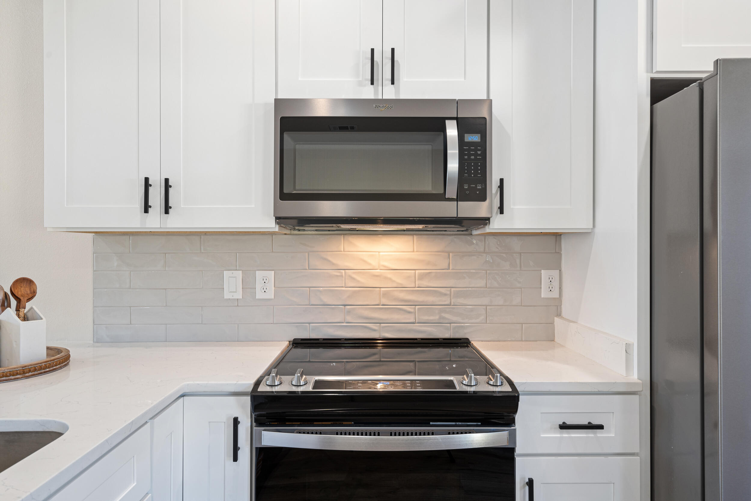 873 Brett Street South Crestview, FL 32539 - Photo 17 of 50 a stove top oven sitting inside of a kitchen