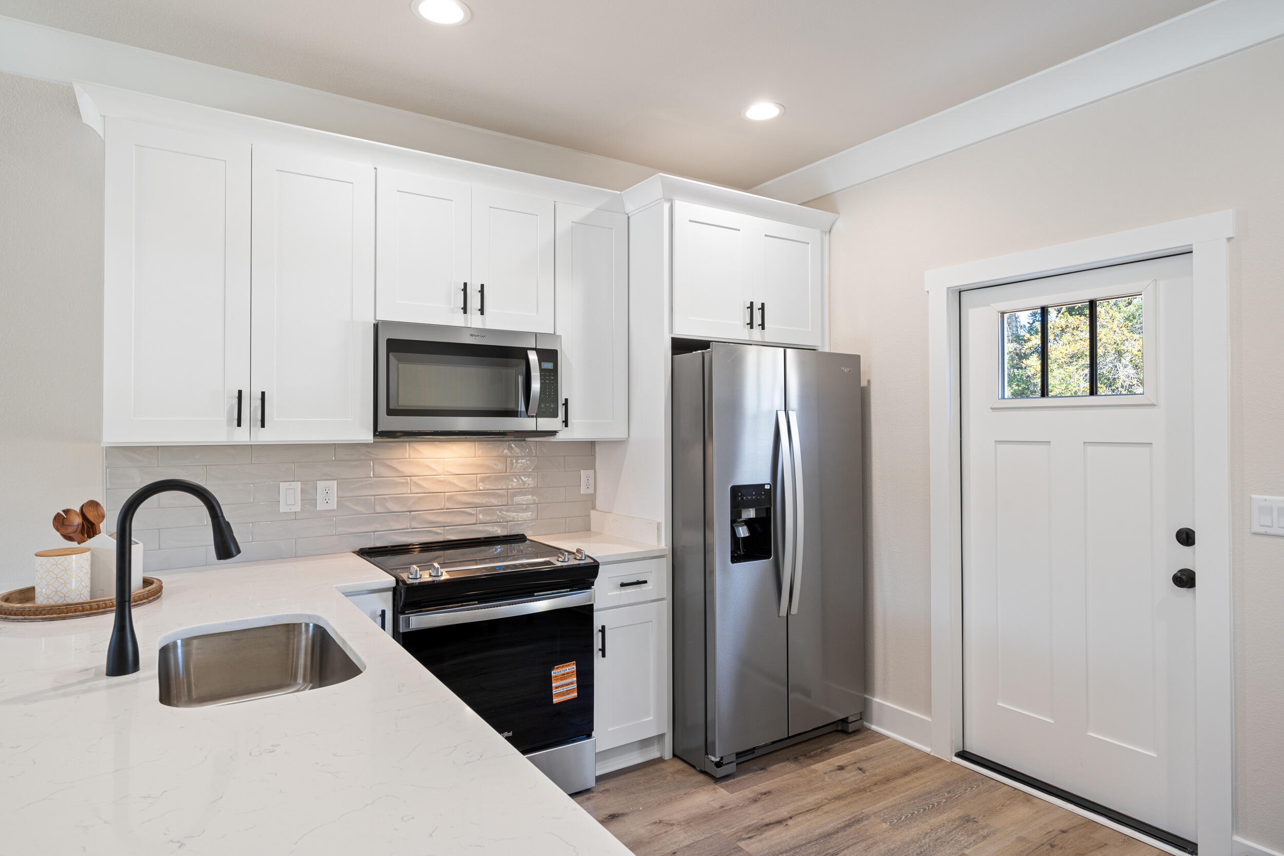 873 Brett Street South Crestview, FL 32539 - Photo 19 of 50 a kitchen with a refrigerator and a sink
