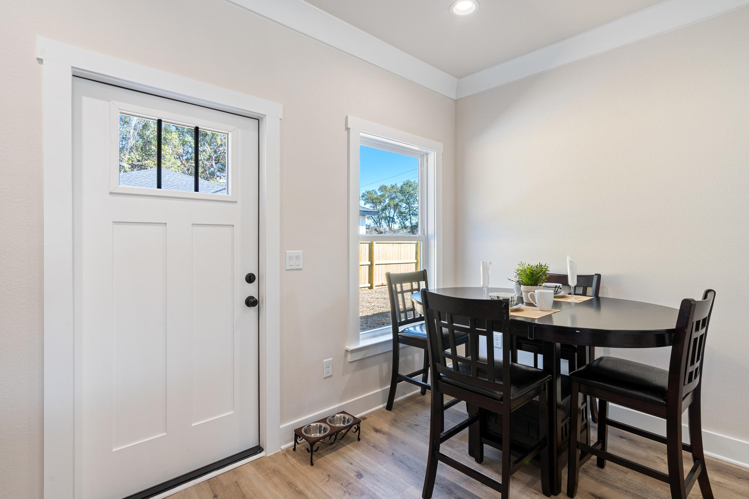 873 Brett Street South Crestview, FL 32539 - Photo 20 of 50 a view of a dining room with furniture window and wooden floor