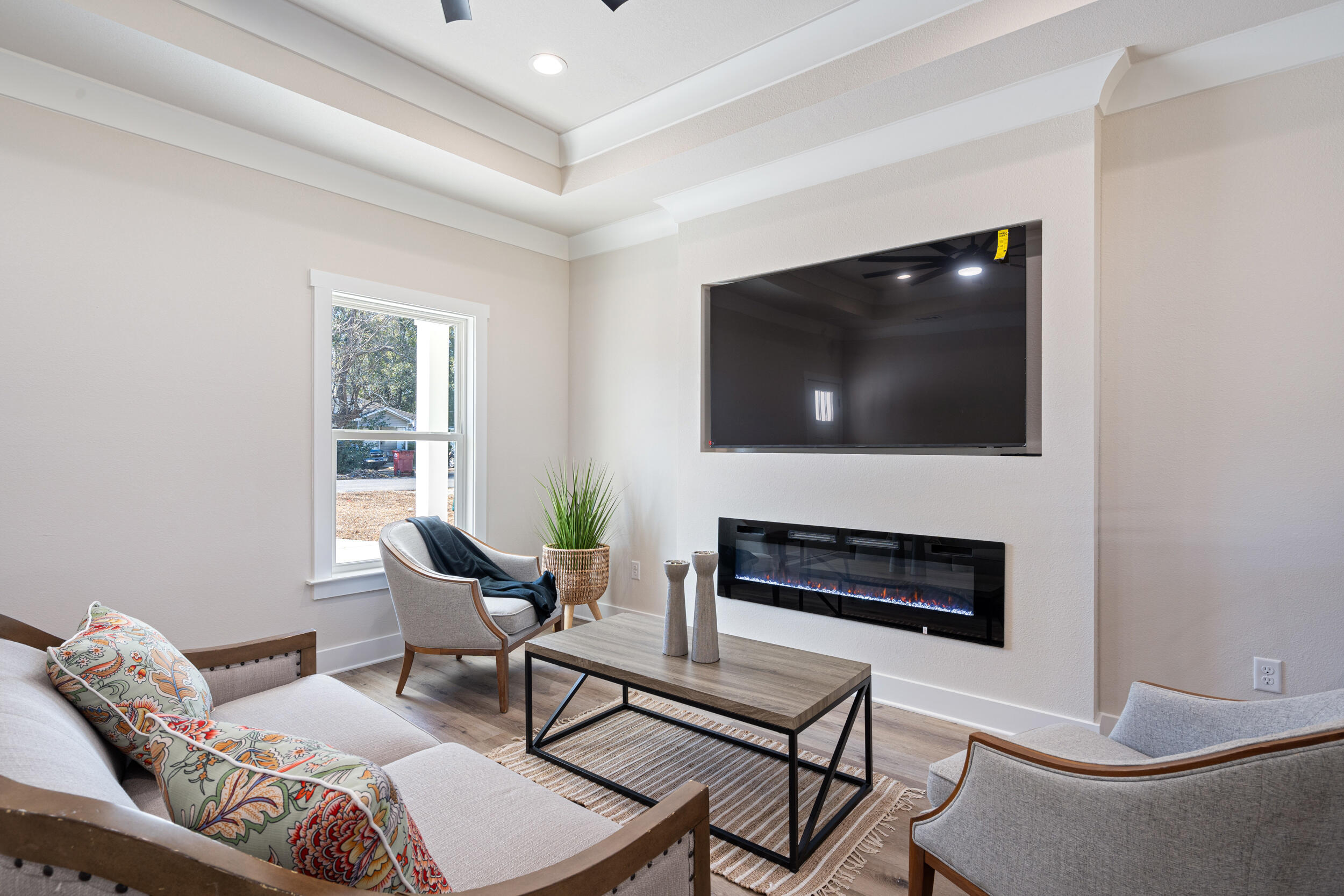 873 Brett Street South Crestview, FL 32539 - Photo 2 of 50 a living room with furniture a flat screen tv and a window